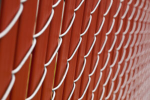 chain link fence with red vinyl 